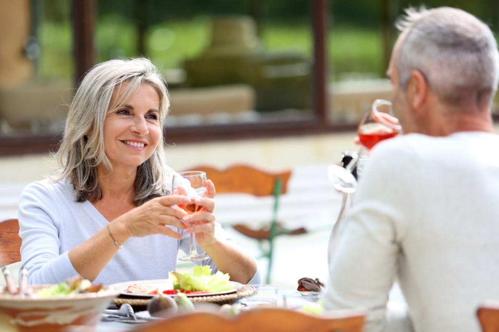 Mature couple wining and dining