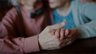 Man and woman holding hands